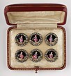 Lot 37 - A set of six painted and enamelled buttons,...