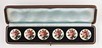 Lot 30 - A set of rose-painted and enamelled silver...