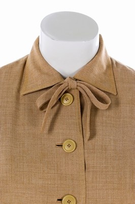 Lot 82 - A Pierre Balmain couture oatmeal linen suit,...