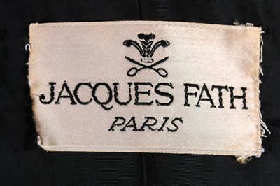 Lot 85 - A Jacques Fath embroidered black satin tent coat, 1954