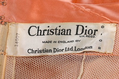 Lot 89 - A Christian Dior London salmon-pink satin ball...