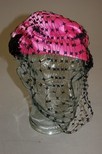 Lot 101 - A Schiaparelli shocking pink toque, circa 1950,...