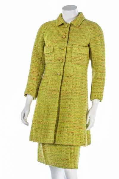 Lot 95 - A Chanel couture chartreuse tweed suit, 1968,...