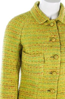 Lot 95 - A Chanel couture chartreuse tweed suit, 1968,...