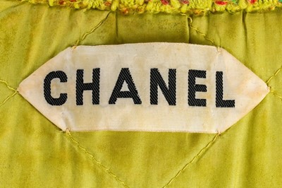 Lot 95 - A Chanel couture chartreuse tweed suit, 1968,...