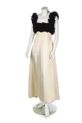 Lot 102 - A ruched white jersey cocktail dress in the...