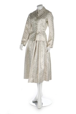 Lot 55 - A four-piece ivory brocade ensemble, early...