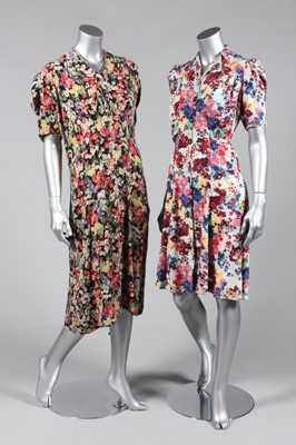 Lot 109 - A group of larger size blouses and dresses,...