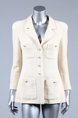 Lot 135 - A Chanel cream jacket, boutique labelled and...