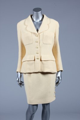 Lot 151 - A Chanel boutique creamy-yellow tweed suit,...