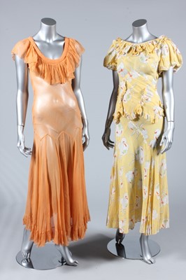 Lot 192 - A floral printed yellow voile garden party...