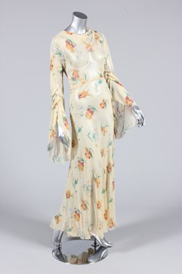 Lot 194 - A printed floral crepe morocain garden party...