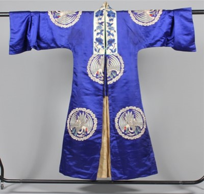 Lot 232 - An embroidered sapphire blue satin robe, circa...