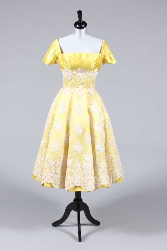 Lot 295 A lemon satin and ivory lace evening gown,