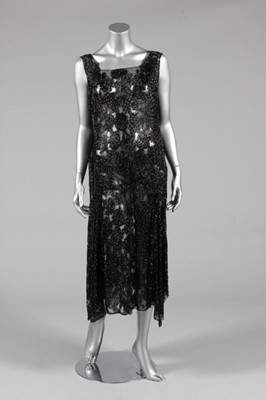 Lot 302 - A beaded black tulle flapper dress, late 1920s,...