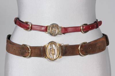 Lot 341 - Four Gucci leather belts, 1970-80s, with large...