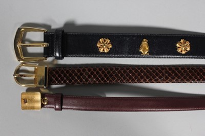 Lot 341 - Four Gucci leather belts, 1970-80s, with large...
