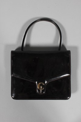 Lot 342 - A Christian Dior chocolate brown patent...