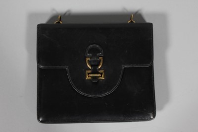 Lot 343 - An Hermès black leather handbag, late 1960s,...