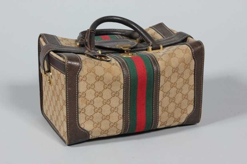 Lot 346 - A Gucci vanity case and four assorted handbags,...