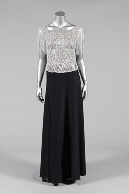 Lot 349 - A Loris Azzaro silver mesh top and black...