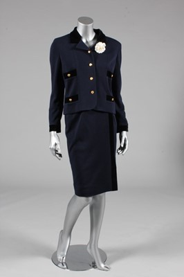 Lot 22 - A Chanel navy jersey suit, 1990s, boutique...