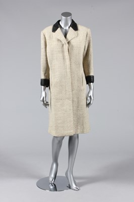 Lot 355 - An Hermès tweed and leather trimmed coat,...