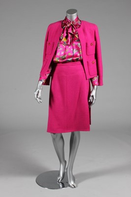 Lot 24 - A Chanel hot pink wool suit, 1990s, boutique...