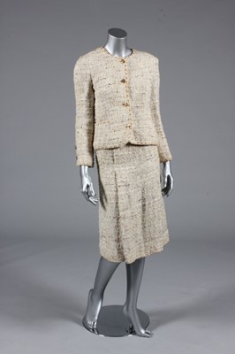 Lot 25 - A Chanel cream tweed suit, 1990s, boutique...