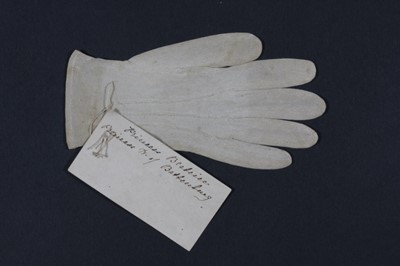 Lot 404 - A finely knitted silk baby glove with note...