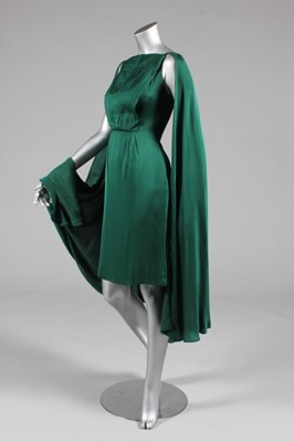 Lot 43 - A Biki green satin cocktail dress, circa 1959,...