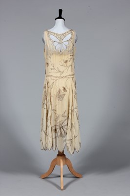 Lot 301 - An beaded ivory chiffon flapper dress with...