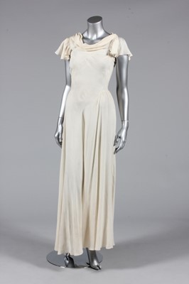 Lot 310 - An ivory bias-cut gown, circa 1930, with...