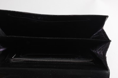 Lot 14 - A black crocodile handbag, early 1960s,...