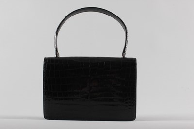 Lot 23 - A Gucci black crocodile handbag, late 1960s,...