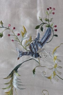 Lot 282 - A quilted and embroidered ivory silk cradle...