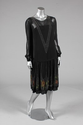 Lot 62 - A beaded black chiffon dress, late 1920s, the...