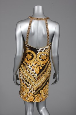 Lot 270 - A Gianni Versace leopard and baroque print...