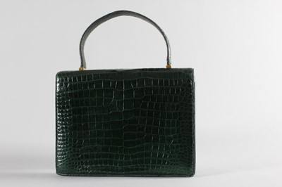 Lot 6 - An Hermès dark green crocodile 'Pascal' bag,...