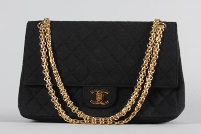 Lot 1 - A Chanel black quilted jersey 2.55 bag, 1960s,...