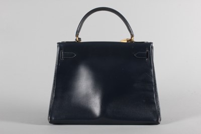 Lot 17 - An Hermès navy box leather Kelly bag, circa...