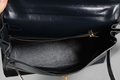 Lot 17 - An Hermès navy box leather Kelly bag, circa...