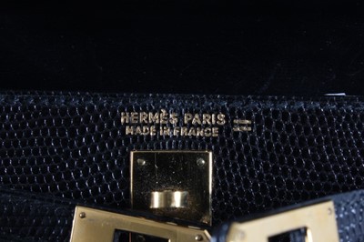 Lot 16 - An Hermès black lizard miniature Kelly bag,...