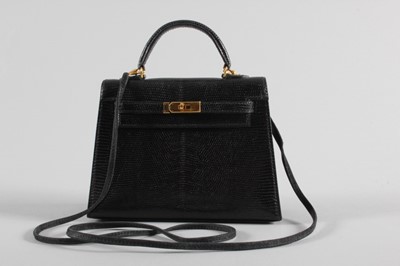 Lot 16 - An Hermès black lizard miniature Kelly bag,...