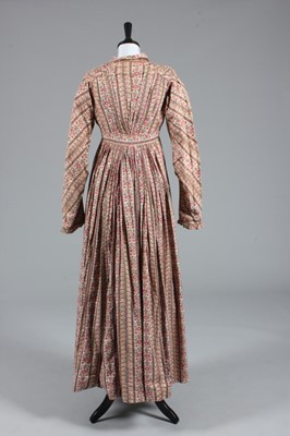 Lot 84 - A block printed cotton day dress, 1820s, front...