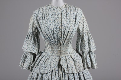 Lot 63 - A printed cotton day dress, circa 1855, with...