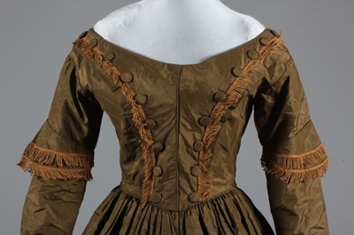 Lot 77 - A bronze silk taffeta day dress, circa 1840,...