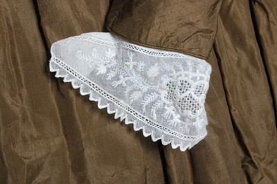 Lot 77 - A bronze silk taffeta day dress, circa 1840,...