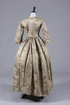 Lot 65 - A mushroom silk damask dress, mid 19th century...