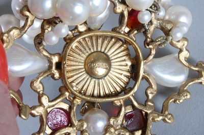 Lot 29 - A Chanel triple strand pearl choker necklace,...